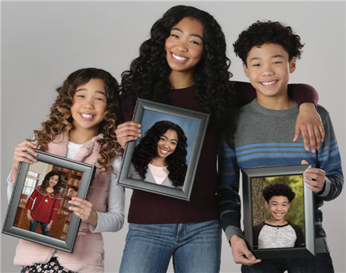 Family Holding Their Own Pictures